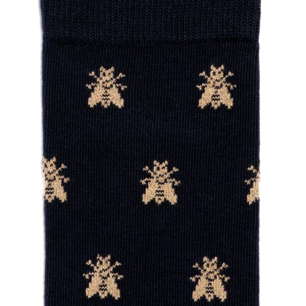 détail du motif des chaussettes les abeilles d'or